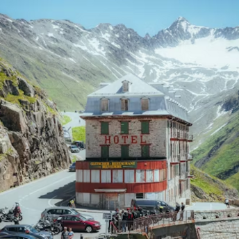 A historic hotel perched on a winding mountain road