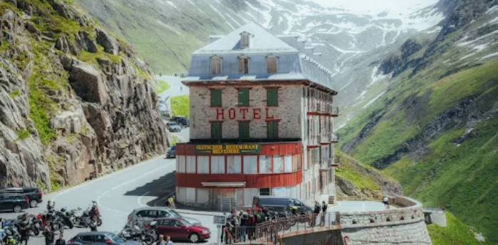 A historic hotel perched on a winding mountain road