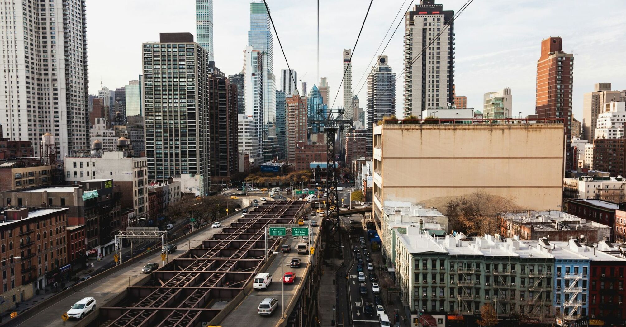 View of Roosevelt Island Tramway overlooking Manhattan's streets and buildings