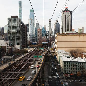 View of Roosevelt Island Tramway overlooking Manhattan's streets and buildings