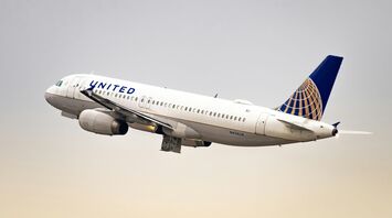 A United Airlines plane taking off into a clear sky, symbolizing travel and seasonal connectivity