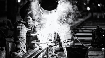 Railway worker performing infrastructure repairs due to damage