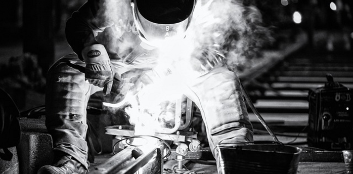 Railway worker performing infrastructure repairs due to damage