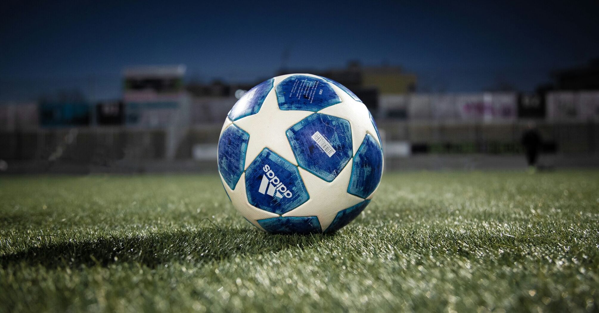Blue and white ball on the pitch
