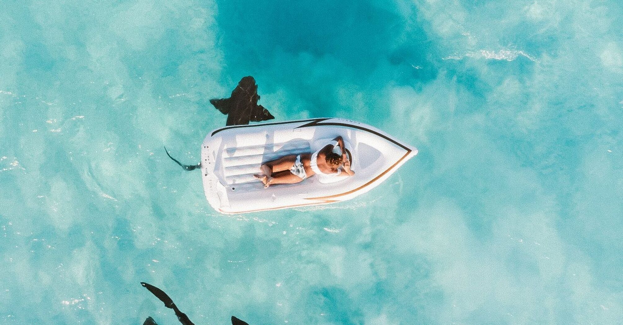 Floating over nurse sharks in the Bahamas on Great Exuma