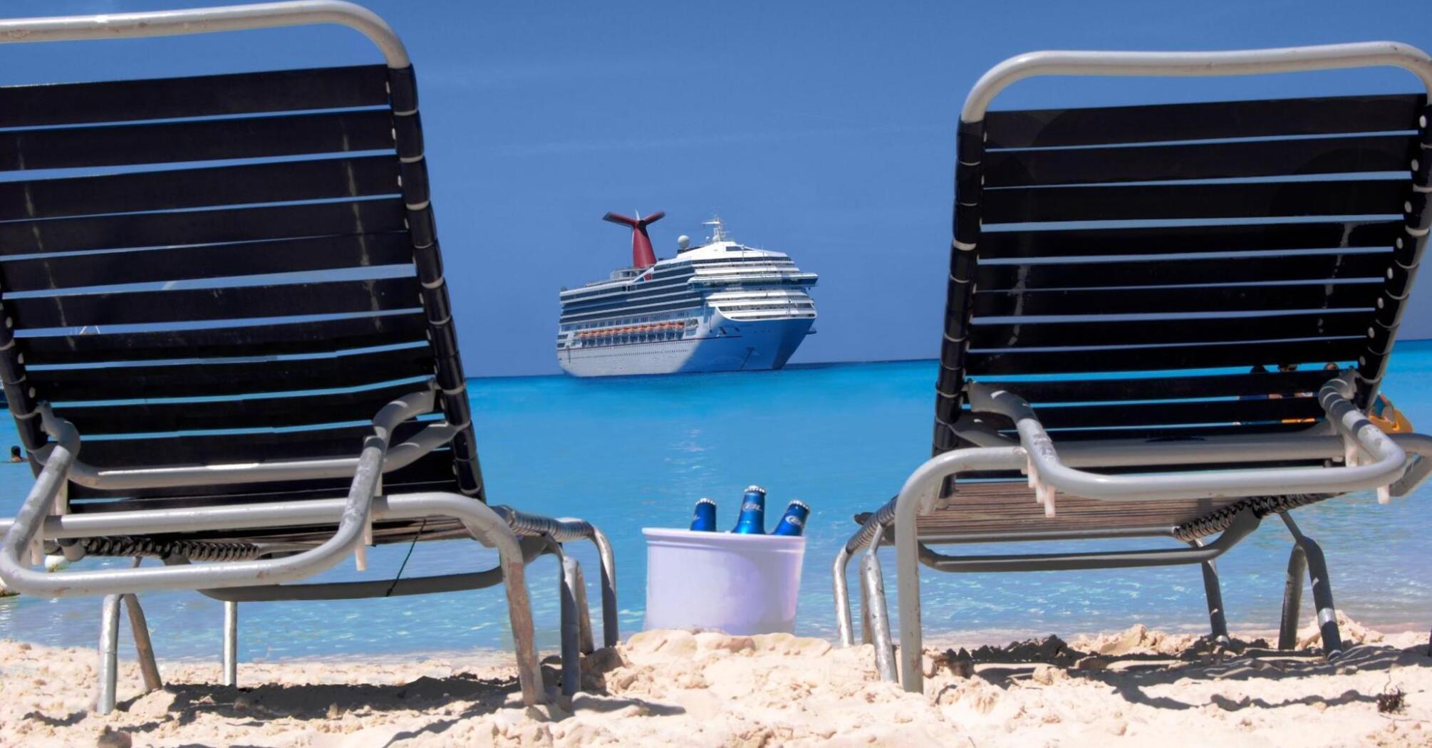 Relaxation loungers overlooking the huge cruise ship Carnival