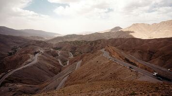 Winding roads meandering through the arid mountainous landscape of Morocco