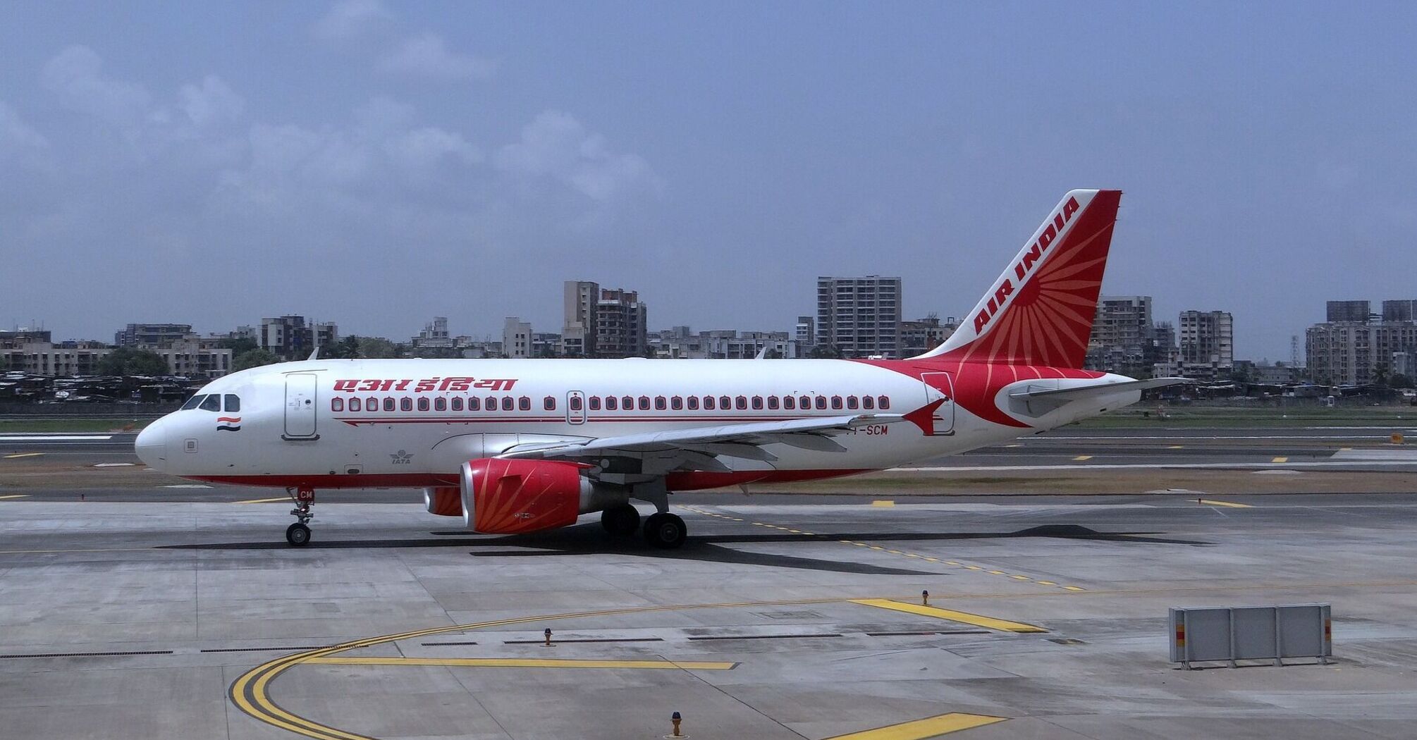 An Air India aircraft parked on the tarmac at an airport