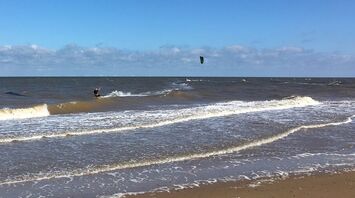 In an English village, the public demands that a beach club demolish a building called a "metal monstrosity"