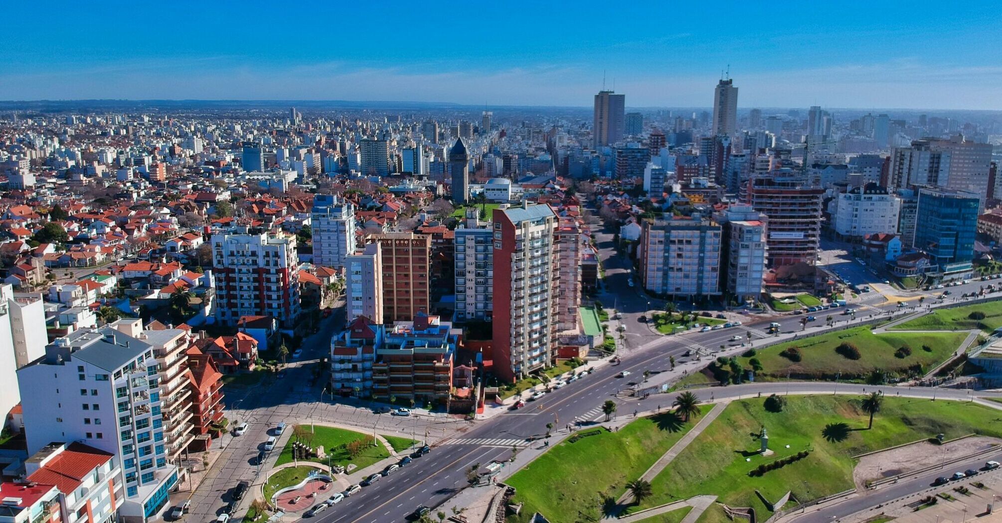 An aerial view of Mar del Plata, showcasing its bustling cityscape with numerous buildings, wide streets