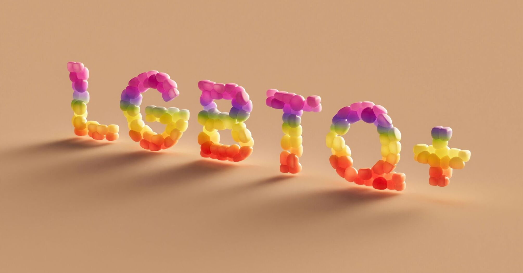 The word 'LGBTQ+' spelled out in colorful balloon-like letters on a pastel background