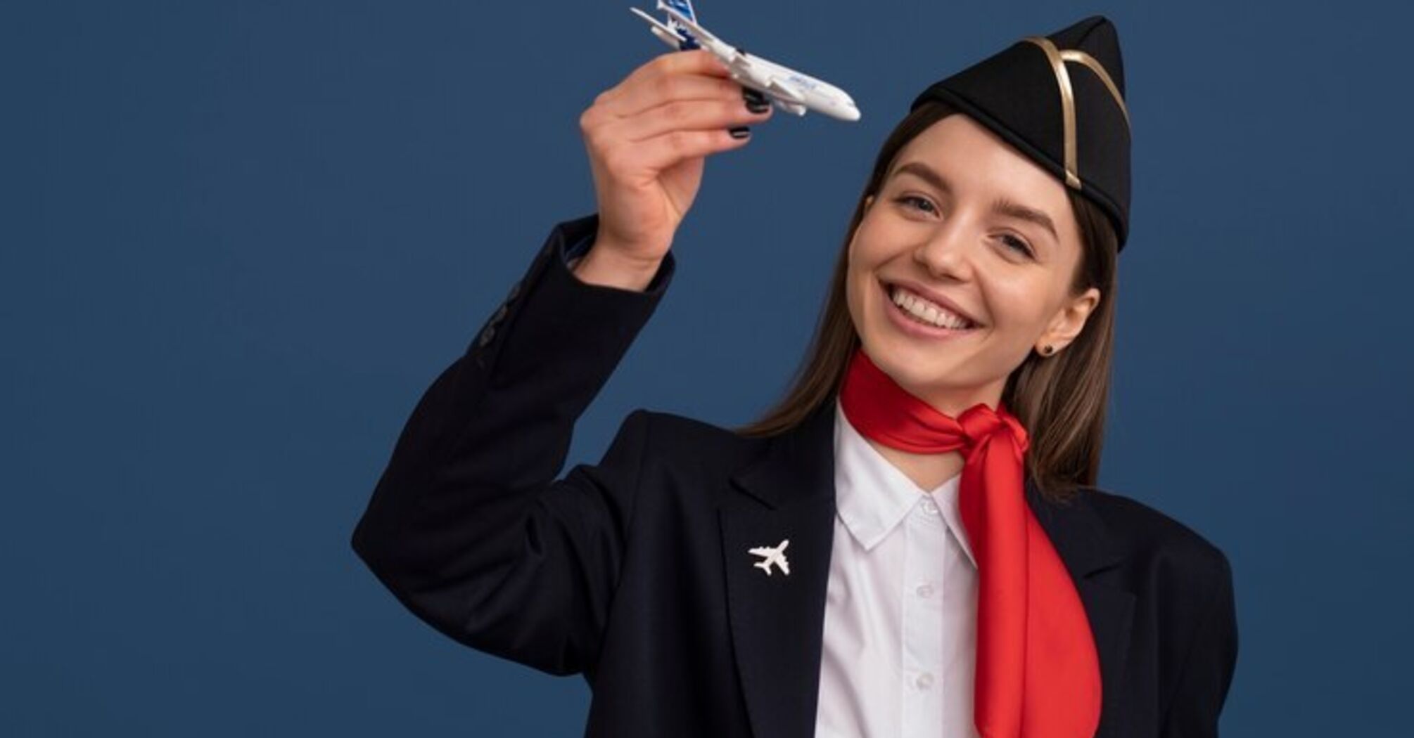 A flight attendant with an airplane