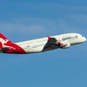 Qantas airline plane flies in the sky