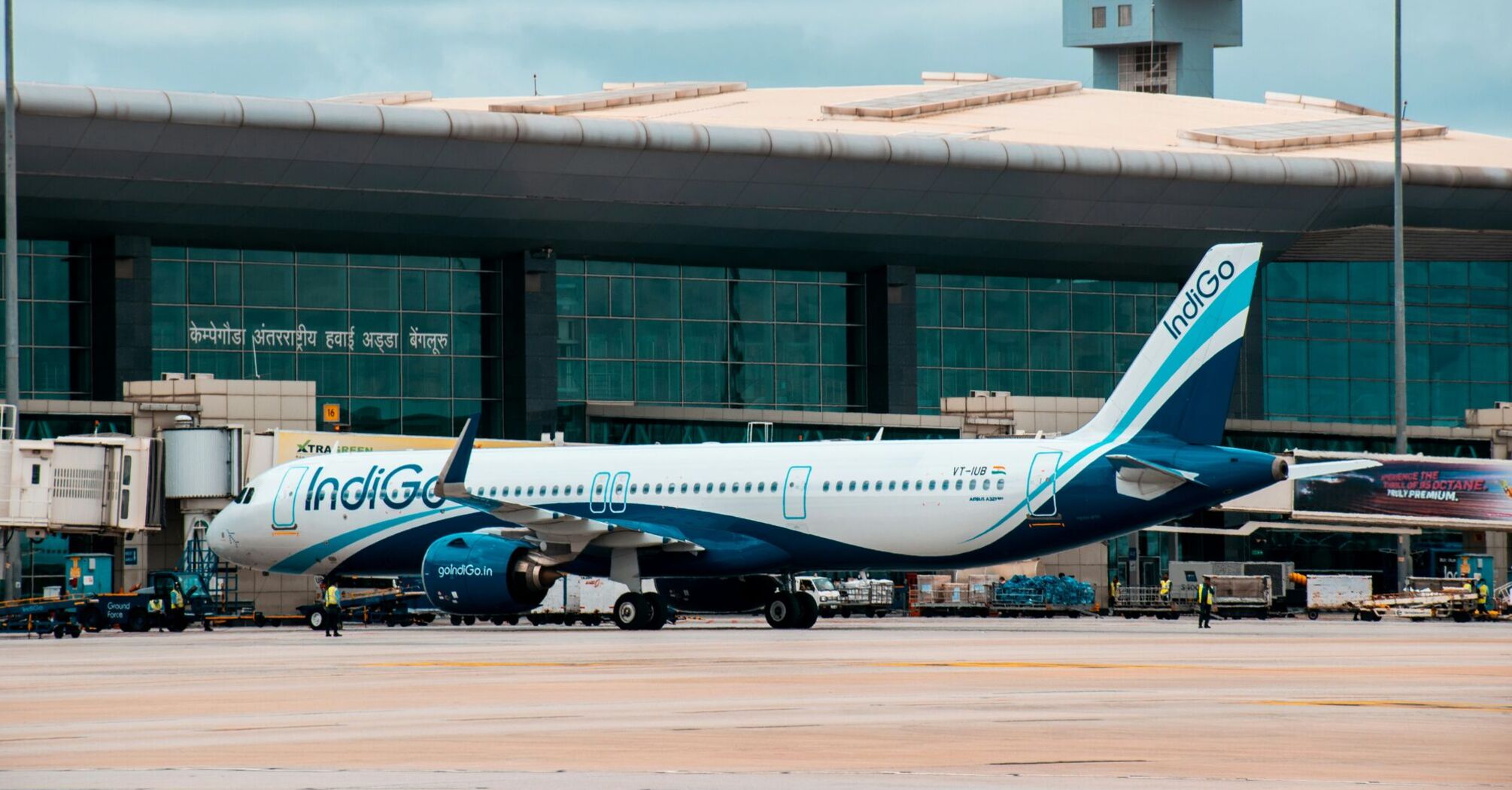Indigo airplane is parked at an airport