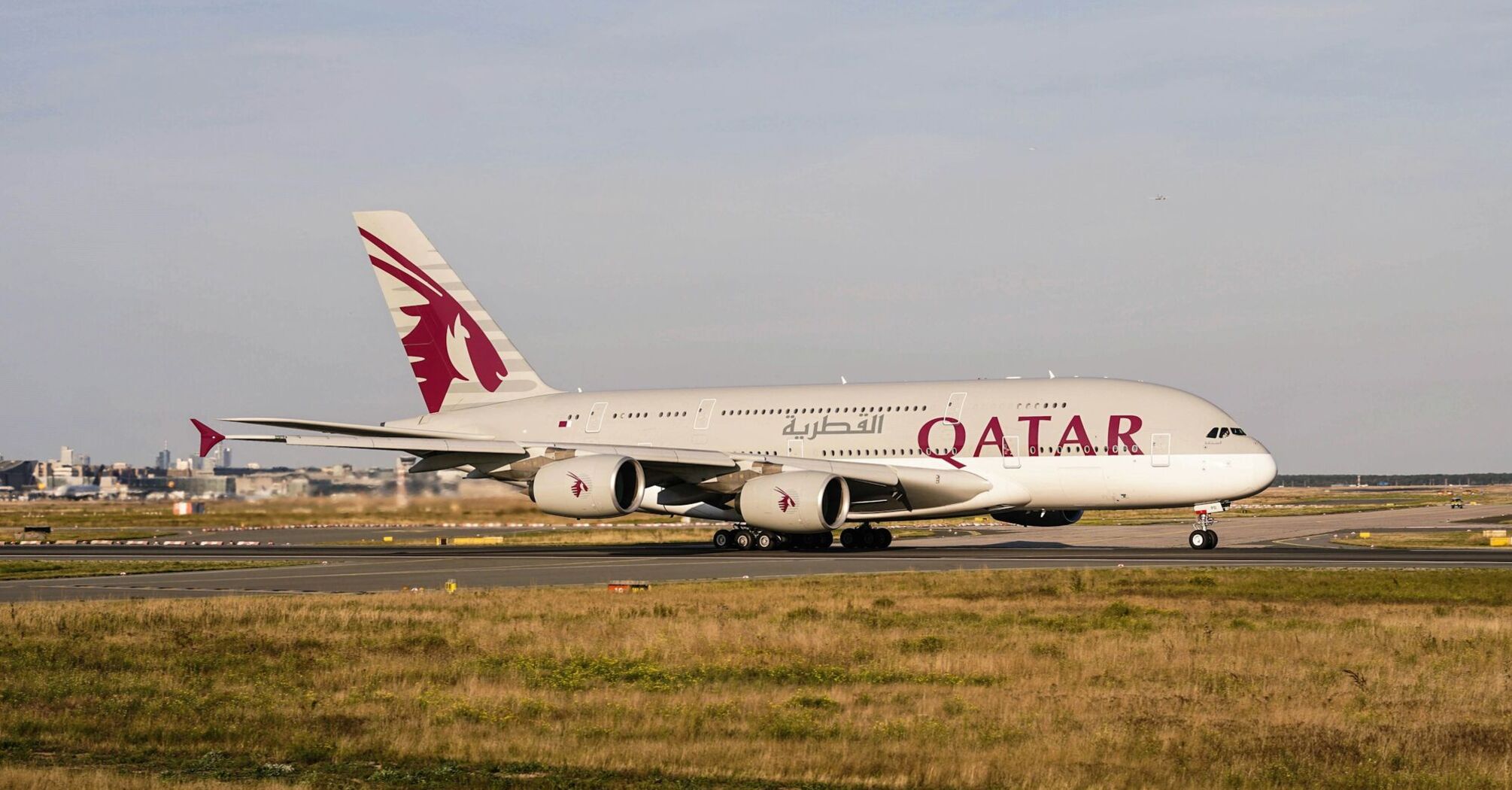A Qatar Airways Airbus on the runway, ready for takeoff