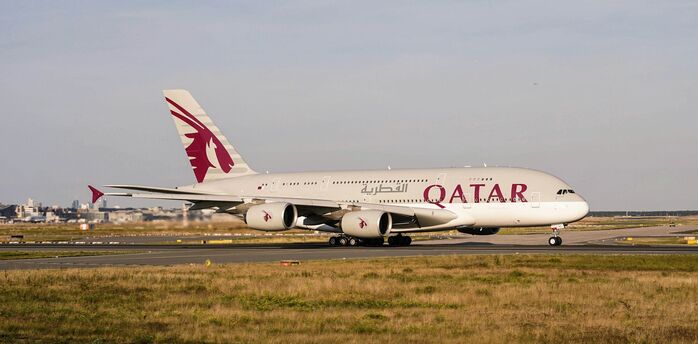 A Qatar Airways Airbus on the runway, ready for takeoff