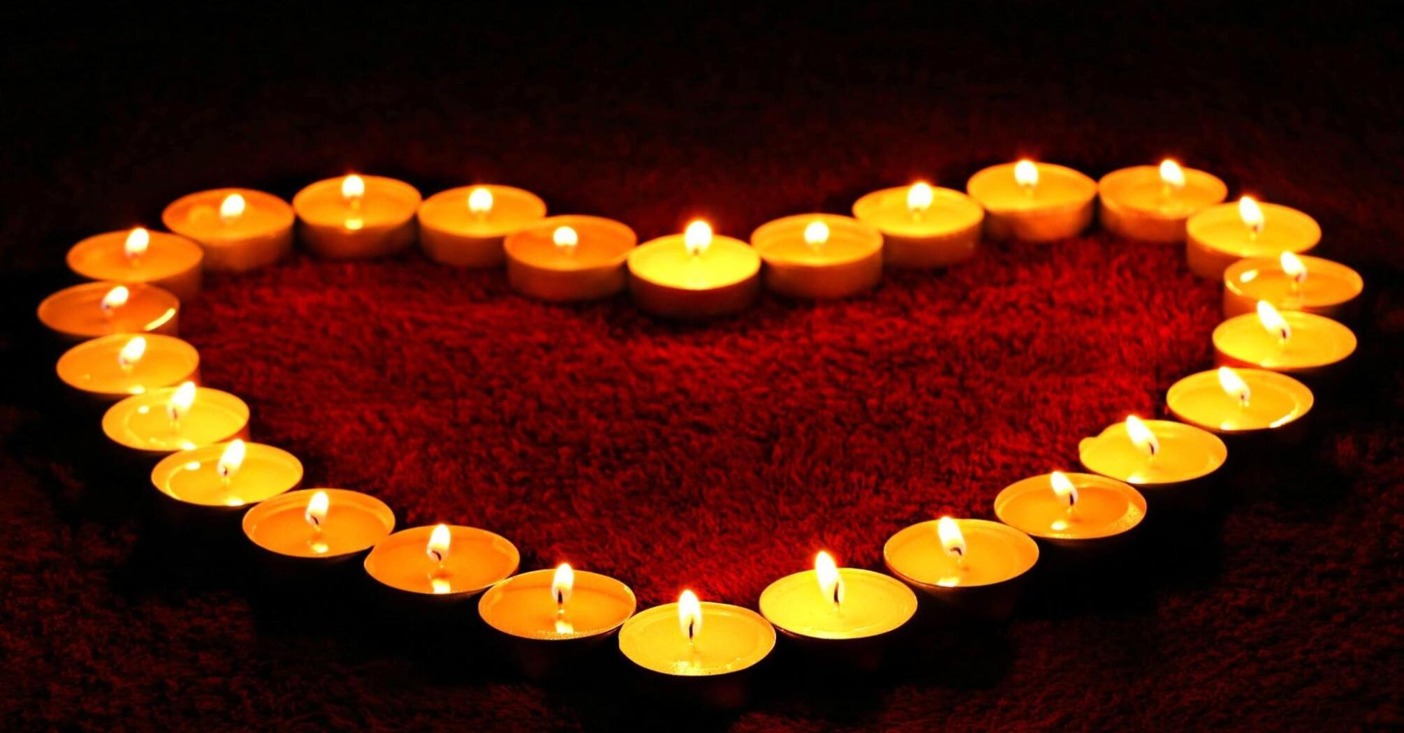 Heart made of burning candles