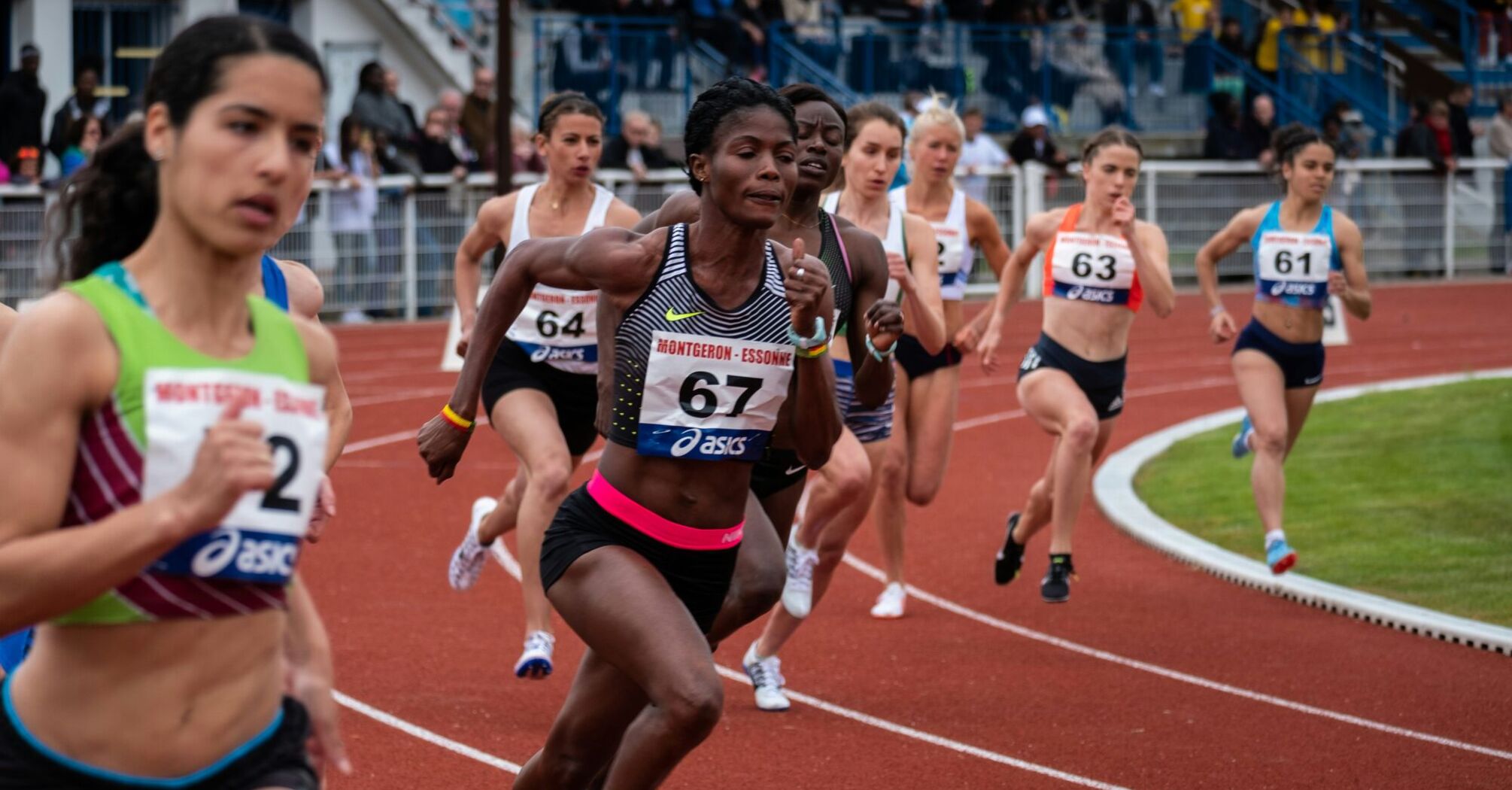 Female athletes during a competitive track race 