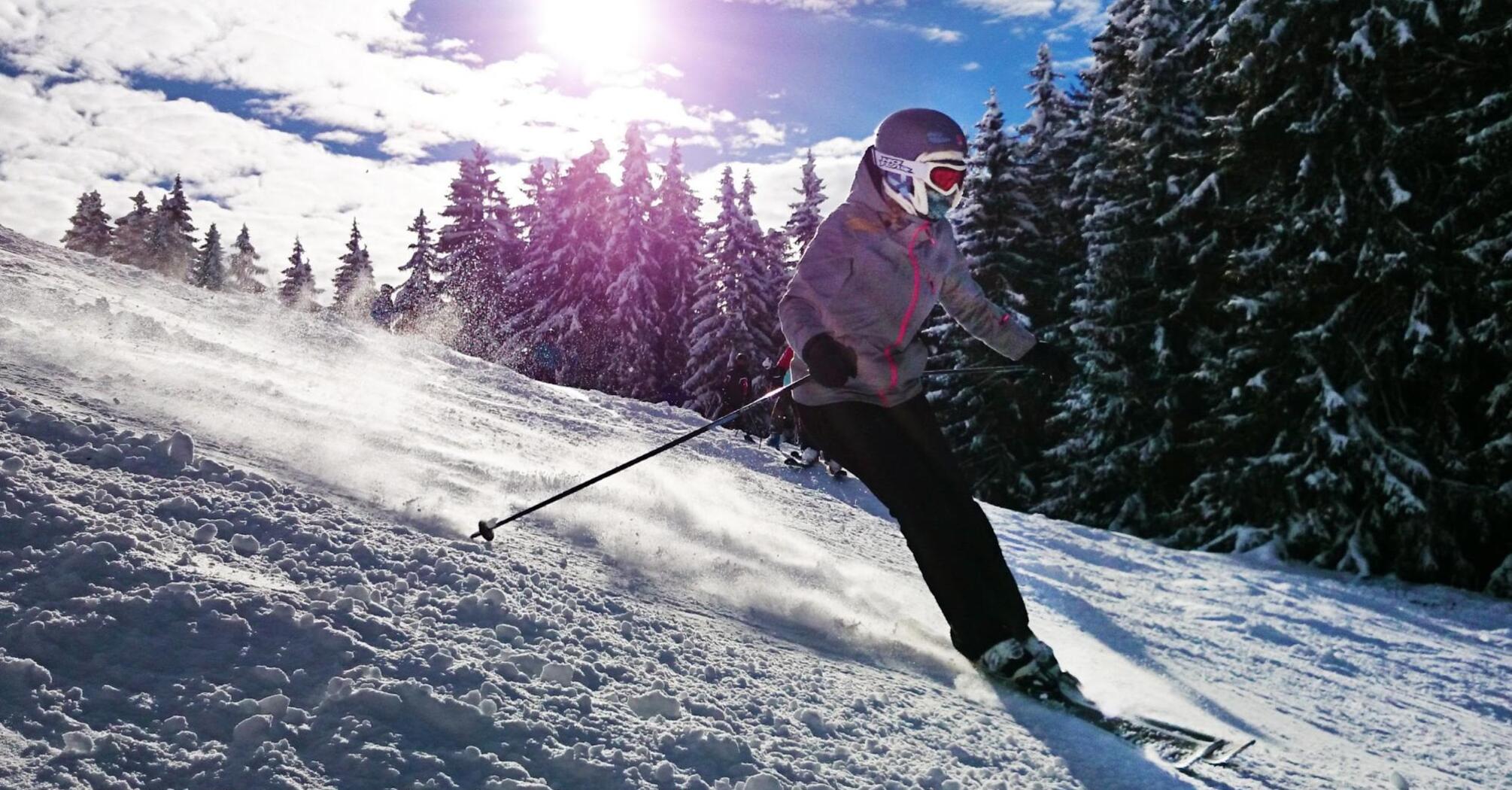 Woman skiing down the mountain