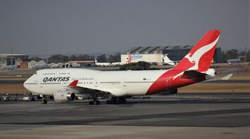 A Qantas baggage handler lost his job over an offensive word written on a tag