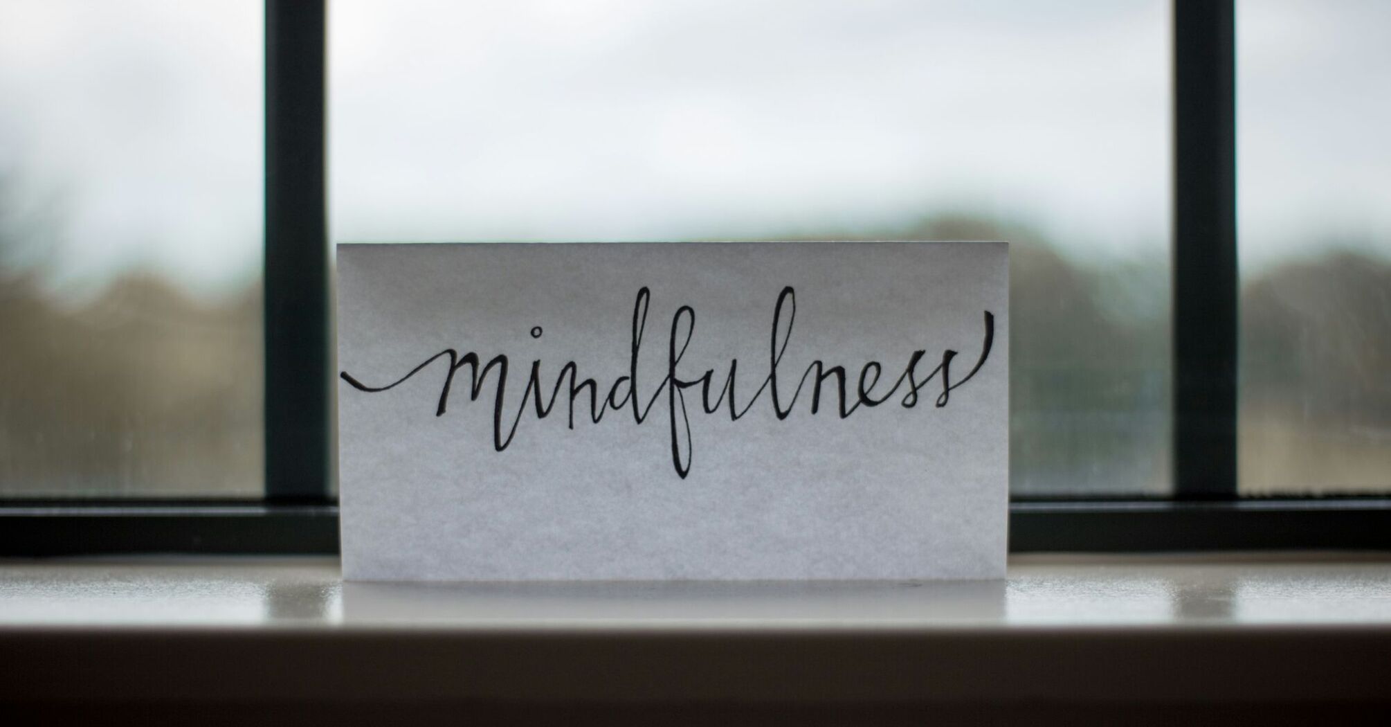 Mindfulness sign on the windowsill