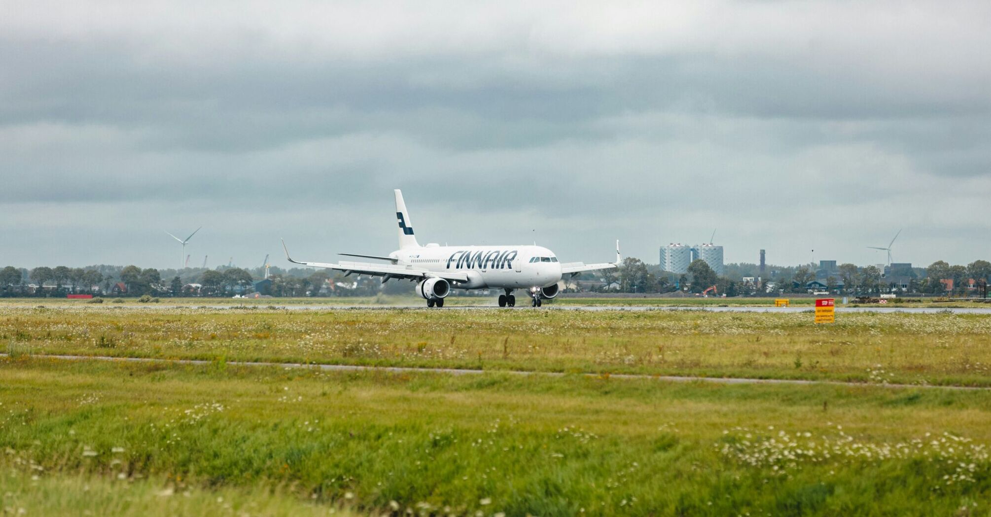 A large jetliner sitting on top of an airport runway