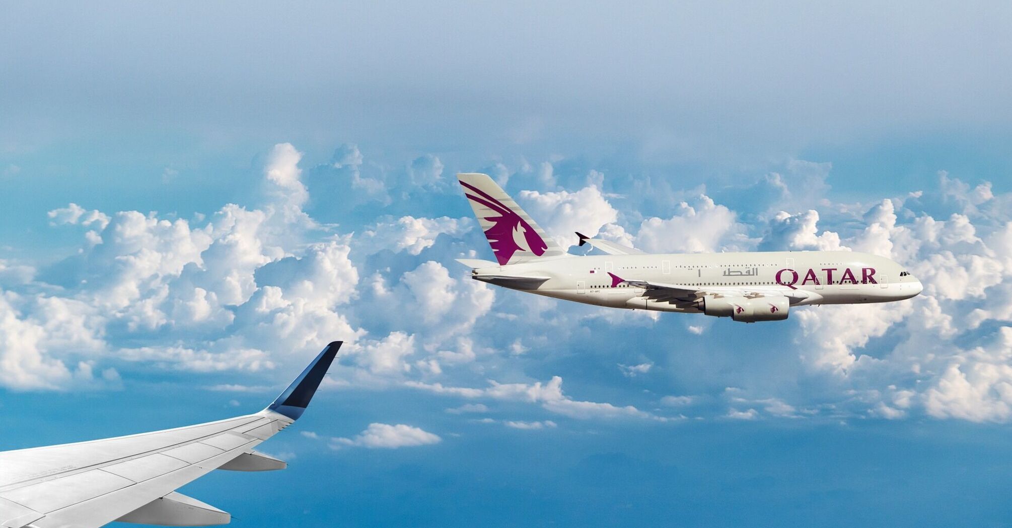 Qatar Airways plane flying in the sky 