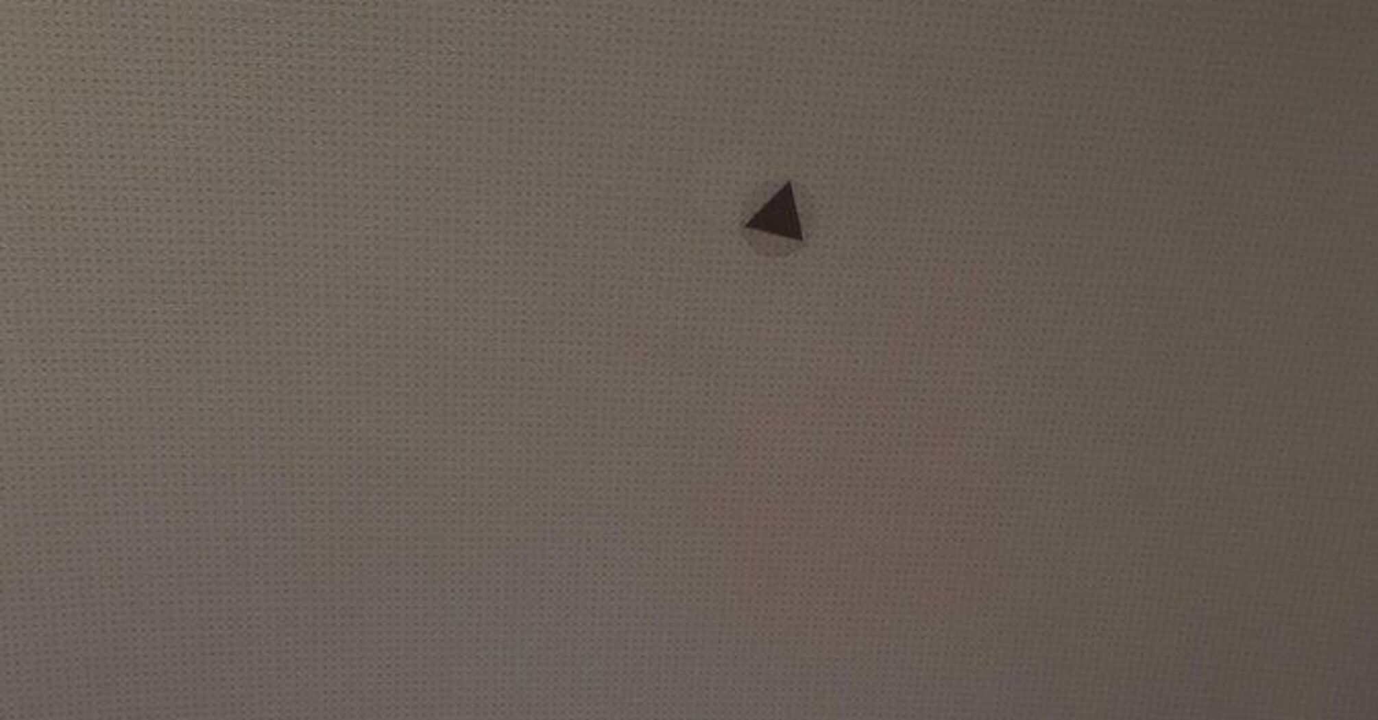 Mysterious triangles: what do these stickers in the airplane cabin mean and why are they useful