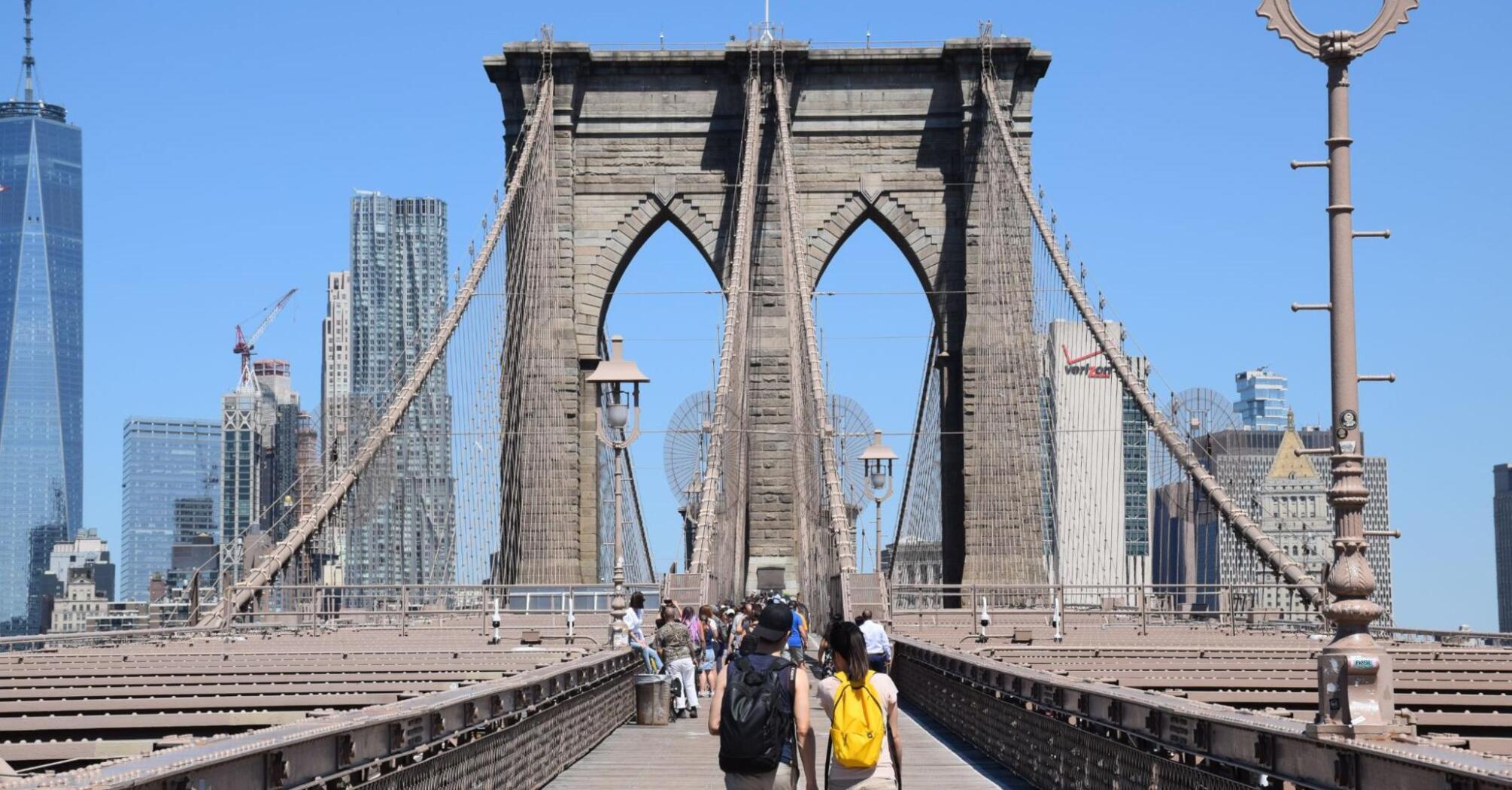 The famous Brooklyn Bridge against the backdrop of city architecture