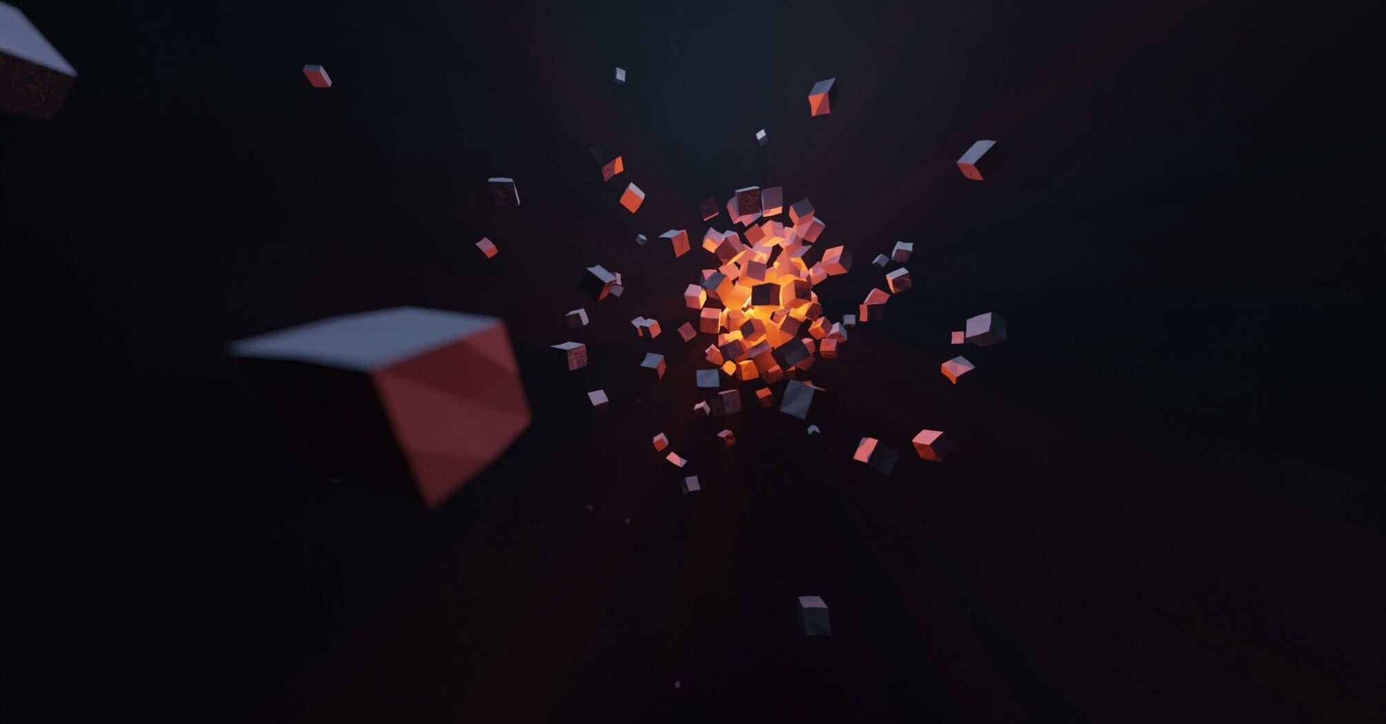 Abstract image of glowing orange cubes expanding from a central point against a dark background with scattered smaller cubes