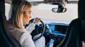 A woman driving a car