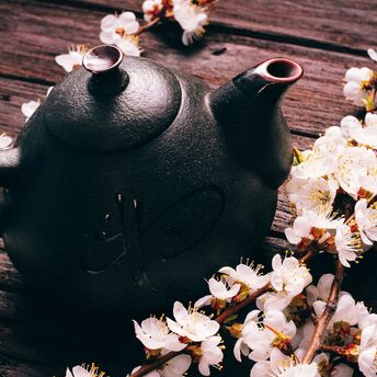 Tea and Sakura on a rustic table
