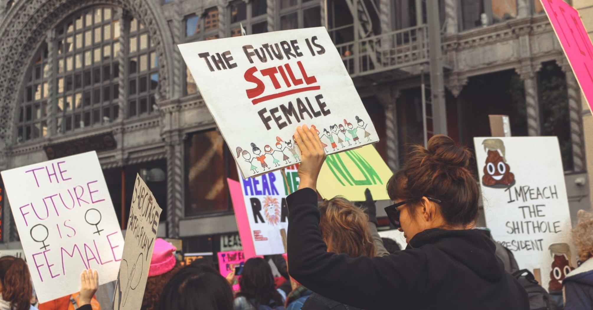 Feminist women's march with posters