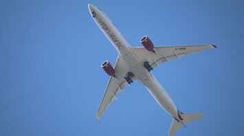 Overhead view of a Virgin Atlantic Airbus A330 in flight against a clear blue sky