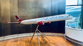A model of a virgin atlantic airplane on a stand