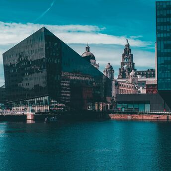 Modern architecture juxtaposed with historic buildings on Liverpool's waterfront