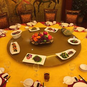 Round table for many people with dishes