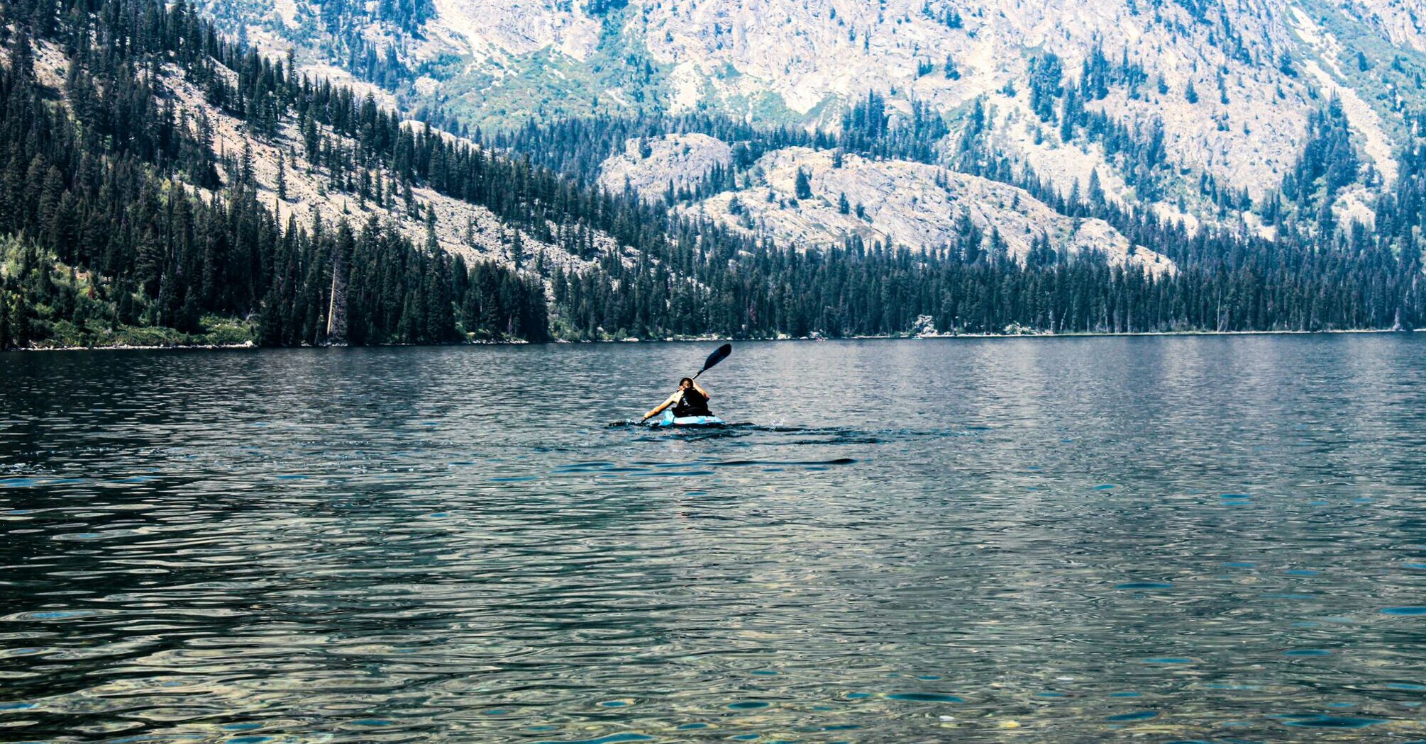 a-person-on-a-surfboard-in-a-lake