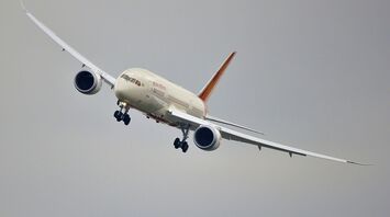 White red and blue airplane above