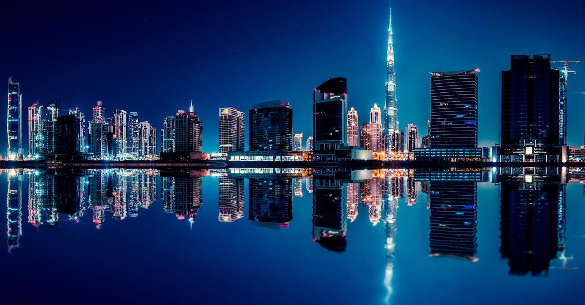 Night city of Dubai on the seashore 