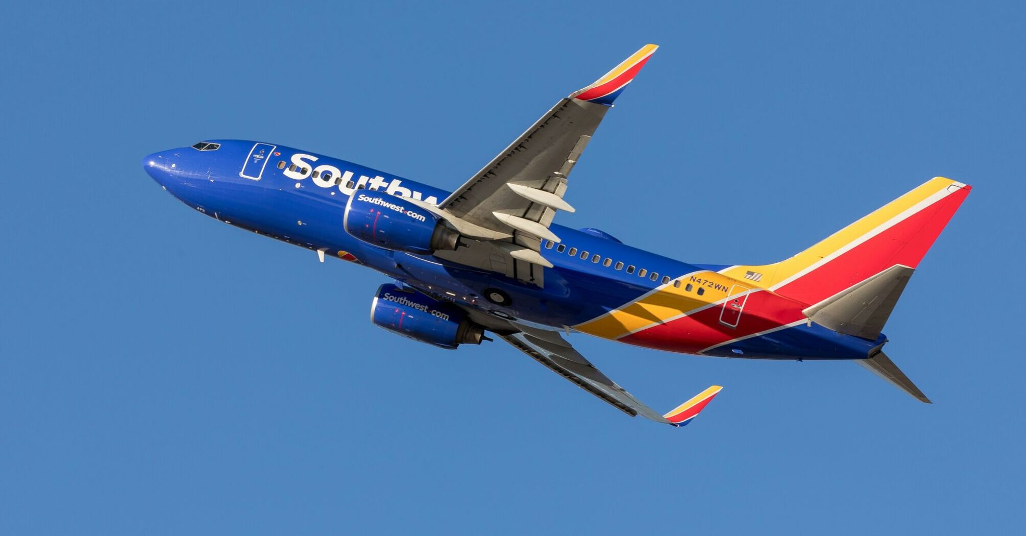 Blue and red airplane on midair