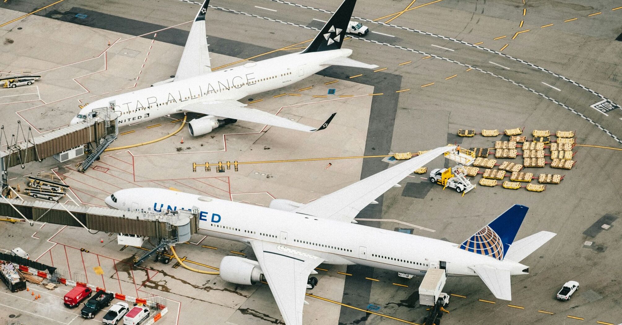 Two white airplanes on airport during daytime