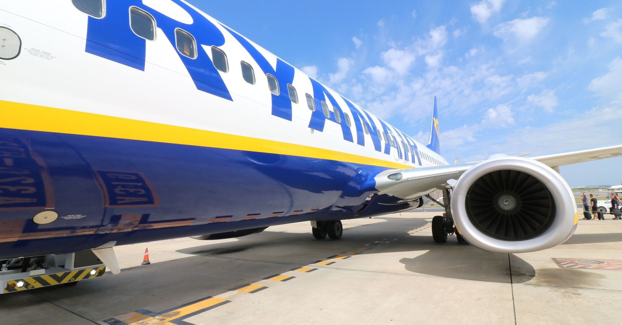Ryanair aircraft on the tarmac with passengers boarding