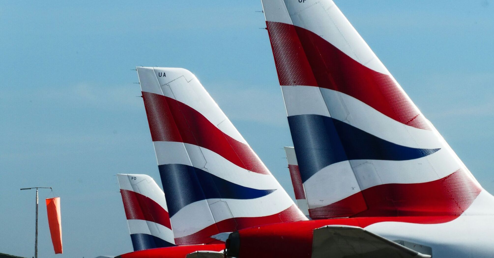 Red, blue and white plane tails