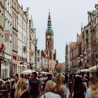 Bustling street scene with historical architecture in Gdańsk, Poland