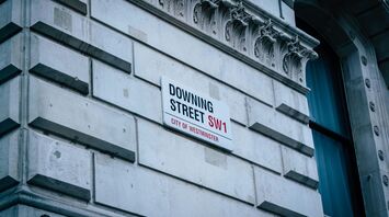 Street sign 'Downing Street SW1' on the wall of a building in the City of Westminster, London