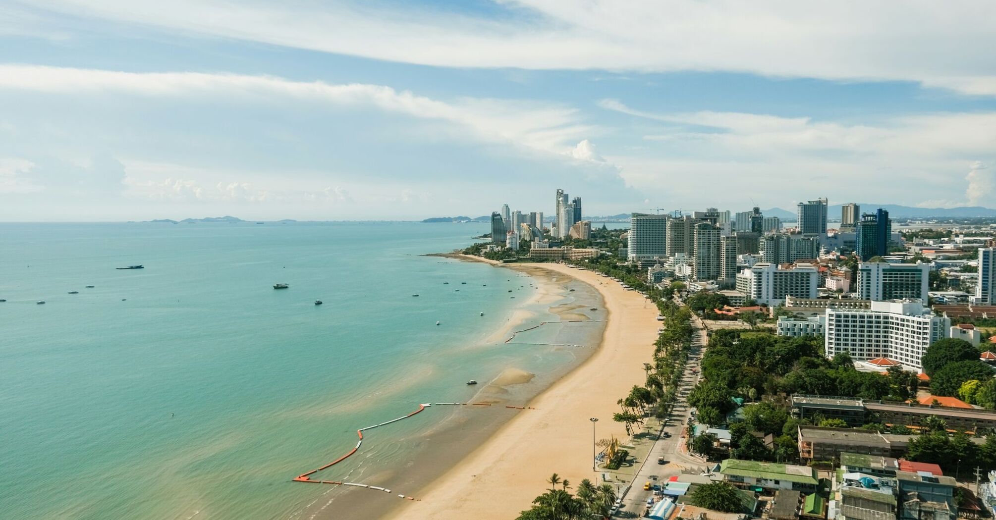 Aerial view of Pattaya cityscape with beach and sea