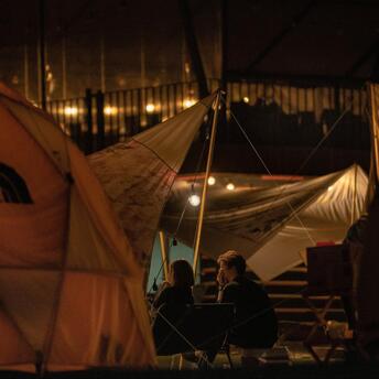 The couple rests in nature in tents