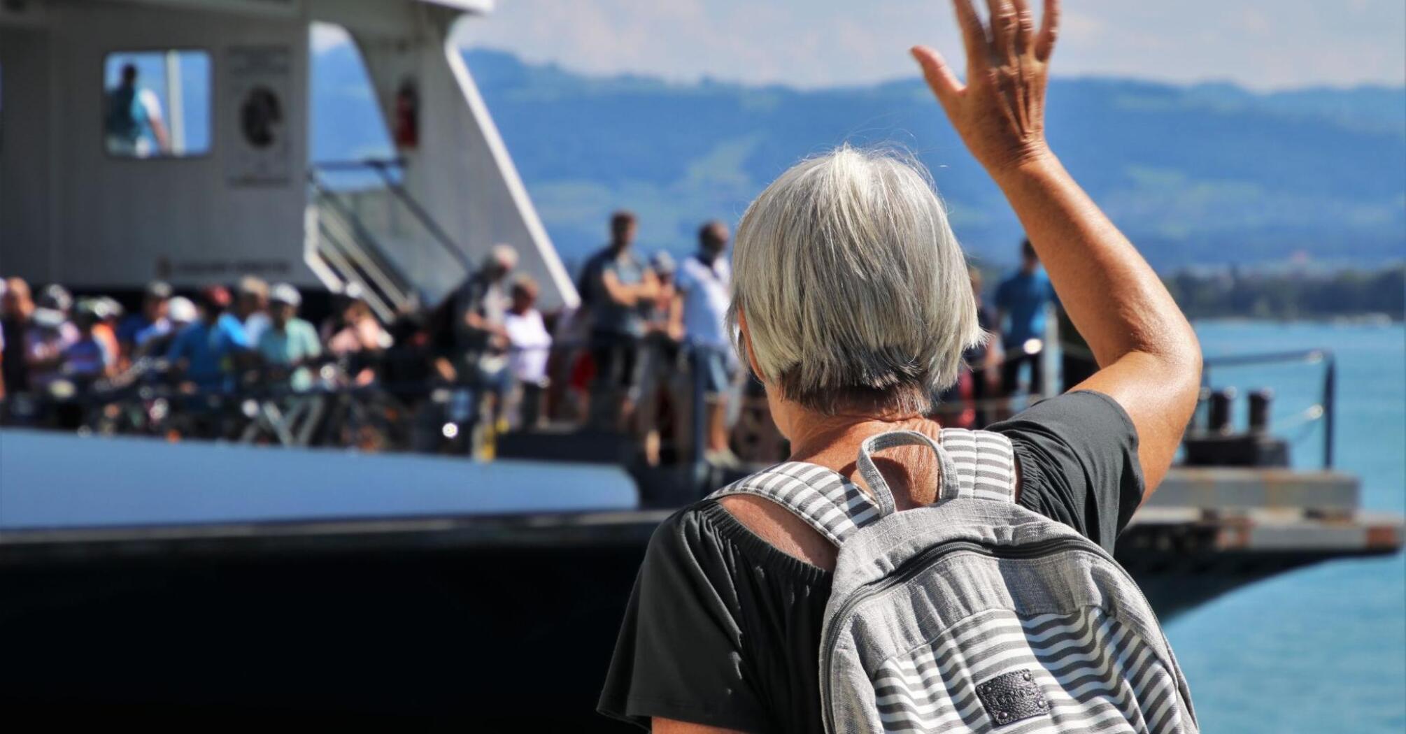 Grandma waves to all present travelers on the yacht