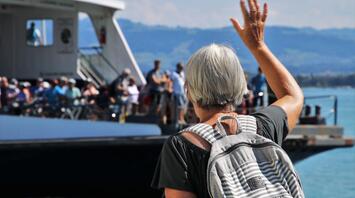 Grandma waves to all present travelers on the yacht